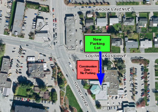 A map showing the new parking lot in green, and how to get to City Hall with a blue arrow.